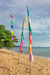 Colorful flags on a beautiful tropical beach on Koh Chang island