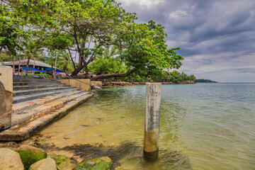 Wooden boardwalk at one of the hotels under a gloomy dramatic sky