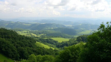 Fototapeta premium Serene Mountain Vista: Rolling hills and lush green valleys stretch out to the horizon under a partly cloudy sky, creating a breathtaking panorama of natural beauty.