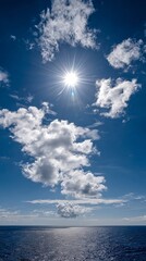 Fototapeta premium Blue ocean and white clouds on a summer day for phone wallpaper