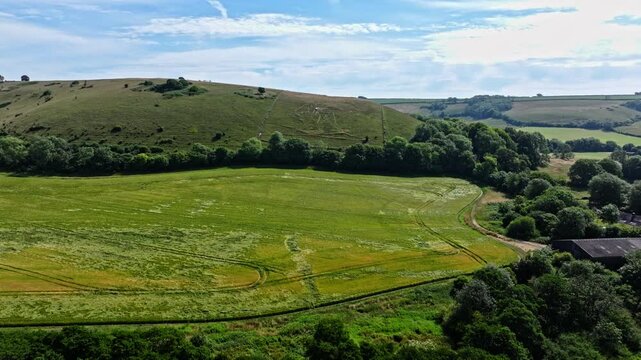 Aerial shot of the Cerne Abbas Giant, a chalk figure on a hillside in Dorset, UK	