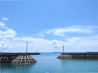 Sunny seaside view with port