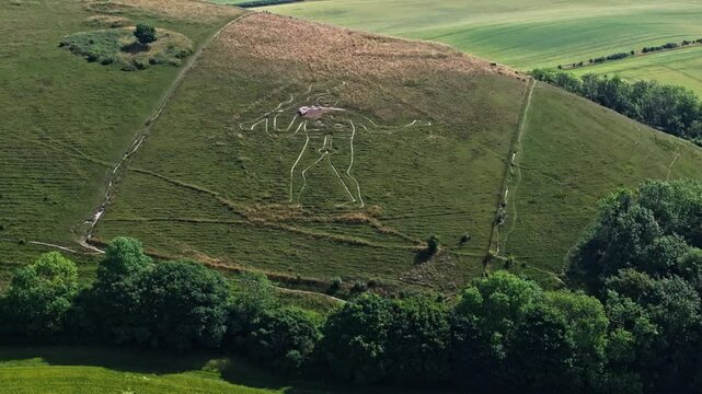 Aerial shot of the Cerne Abbas Giant, a chalk figure on a hillside in Dorset, UK