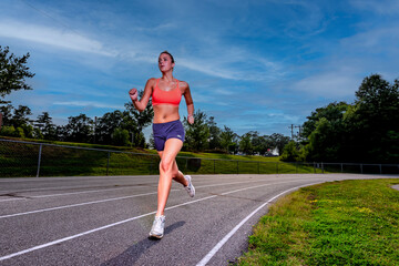 Summer Grind: Teen Athlete Trains with Determination for Upcoming Track Meet