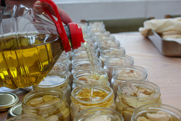the process of adding olive oil to bonito