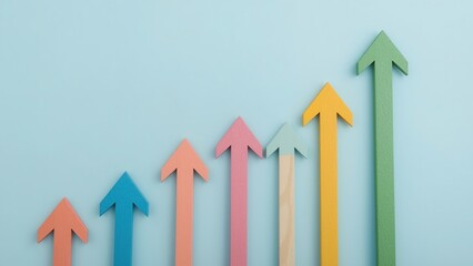 Rising colorful arrows symbolize growth, progress and success on a light blue background.