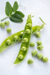 Fresh green peas beans in pods, white background, macro photo