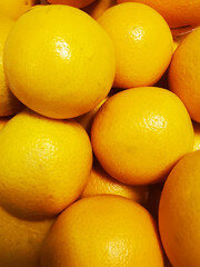 Top view of fresh oranges filling the entire frame, showing vibrant color and texture for use in food, background, or healthy lifestyle concepts.