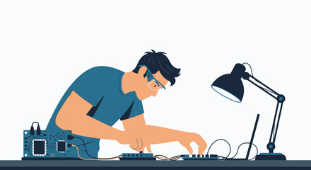 Young Engineer Assembling Electronic Circuit Board At Desk Under Lamp Light