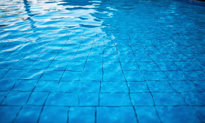 Obraz premium An Empty Swimming Pool its Blue Tiles Creating a Clean Geometric Grid
