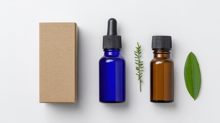 Two Essential Oil Bottles with Cardboard Box and Green Leaves on