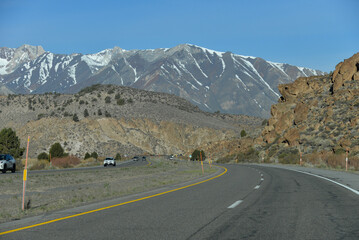 Mammoth Lakes, CA USA - April 26, 2021: The road with the mountants on the background which leads to Mammoth Lakes