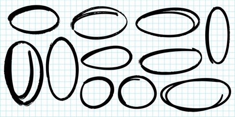 collection of hand drawn oval and circle shapes in black marker on a blue grid paper background.
