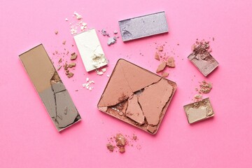 Beautiful eyeshadow refill pans on pink background, flat lay