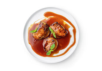 Grilled fillet mignon steak or grilled beef medallion with sauce and vegetable on plate isolated on...