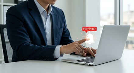 businessman working and receiving a reminder notification bell icon on computer. businessman interacting with a digital interface that displays and touches a reminder notification bell icon.