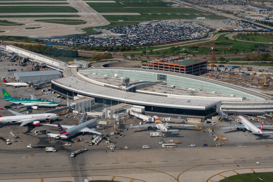 O'Hare Airport, Chicago, Illinois, USA - September 26, 2023 - Aerial view of Terminal 5 at Chicago's O'Hare Airport - ORD with from Air Lingus, Austrian Airlines, American Airlines, and Air Belgium 