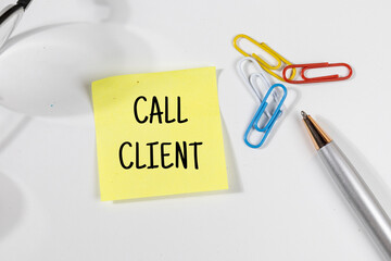 Office Note “Call Client” Set on Office Desk – Task & Outreach Concept