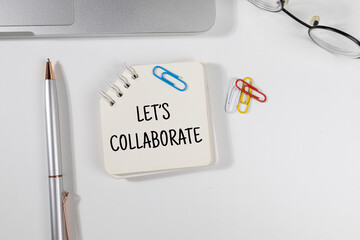 Office Note “Let’s Collaborate” Set on Office Desk – Teamwork & Initiative Concept