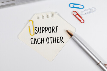 Office Note “Support Each Other” Set on Office Desk – Teamwork & Culture Concept