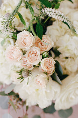 Beautiful arrangement of blush and white flowers in a decorative setting during a joyful celebration in spring