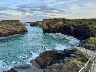 Cathedrals beach during high tide, Ribadeo, Spain. The whole beach and the bottom of stairs all...