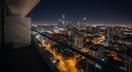 Naklejka premium Night Cityscape Panoramic View from a Modern Balcony