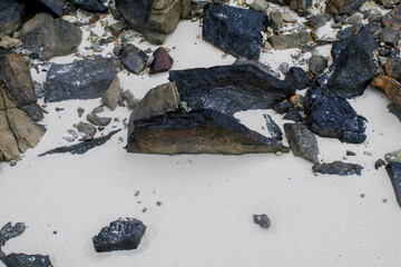 Rock or stone rough texture surface on beach seashore. Nature landscape background. Summer travel destination.