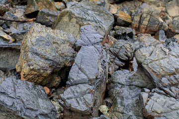 Rock or stone rough texture surface on beach seashore. Nature landscape background. Summer travel destination.