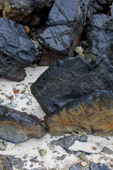 Rock or stone rough texture surface on beach seashore. Nature landscape background. Summer travel destination.