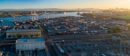 Aerial view of the Port of Oakland, California, USA, showing shipping containers, cranes, and the...