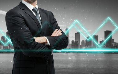 Businessman with crossed arms stands before a city skyline and rising graph.