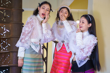 A Group of beautiful Asian women wearing Traditional Lanna Dress with a Western-inspired lace...