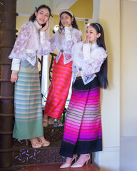 A Group of beautiful Asian women wearing Traditional Lanna Dress with a Western-inspired lace...