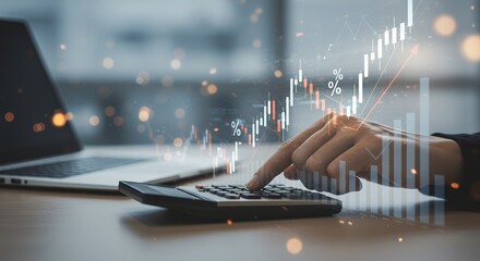 Person using calculator with laptop and ascending graph overlay representing financial growth.