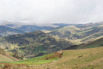 Beautiful sunset landscape of colombian andean mountain range with grey cloudy sky