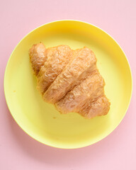 Fresh croissant on plate and copy space for your product.