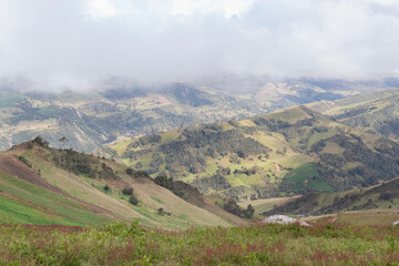 andean colombian grass mountains with grey clouds