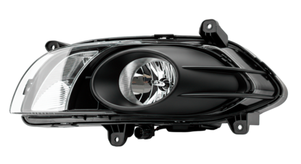 Close-up shot of a sleek car headlight, perfect for automotive or design projects, isolated on black.