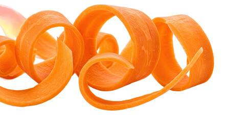 Carrot ribbons curl and twist in a vibrant display of fresh vegetable art