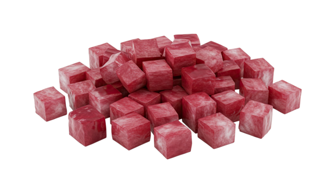 Pile of fresh raw diced beef cubes in a close up studio shot on black