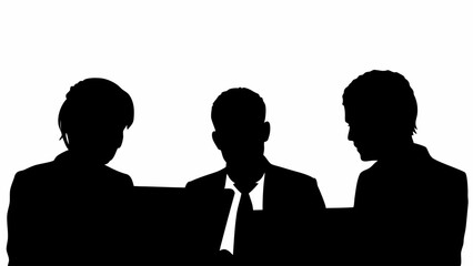 Silhouette of three business professionals working on laptops in a collaborative office environment setup