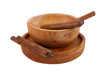 cinnamon in a wooden bowl with a white isolated background
