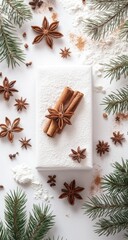 White gift box adorned with cinnamon sticks, star anise, and pine sprigs