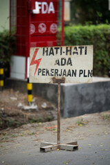 Cilegon, Indonesia-August 24, 2021: An Indonesian warning sign 