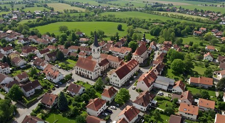 Aerial View of a Charming European Village Nestled in Lush Green Fields