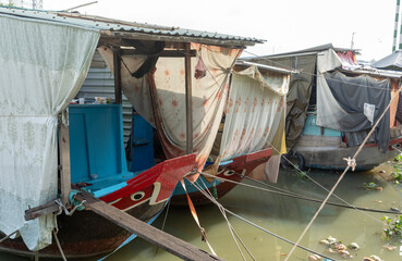 Vietnamese houseboats at floating market early sunny morning. 