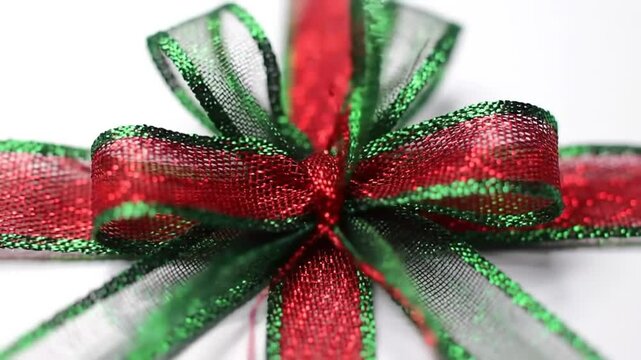 A Close-Up View of a Festive Red and Green Ribbon Bow