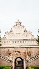 Yogyakarta, Indonesia-January 27, 2023: The ornate historical gate of Situs Taman Sari in Yogyakarta, Indonesia, showcasing intricate Javanese architecture and weathered stone.