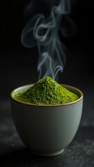Close up of matcha powder in a bowl with steam rising on a dark background